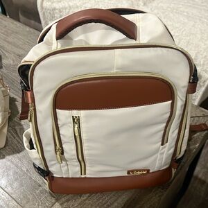 NWOT Cream and Brown Backpack with USB port.